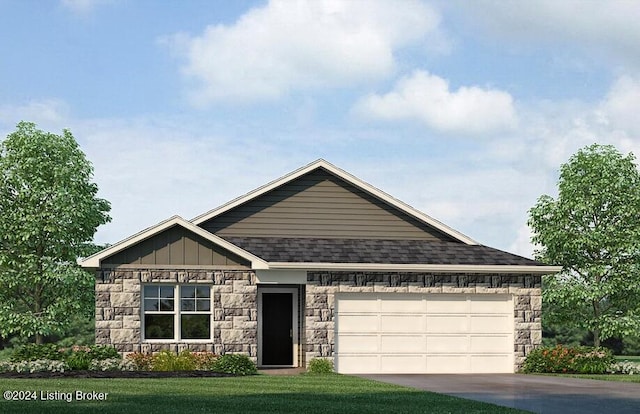 view of front of house featuring a front yard and a garage