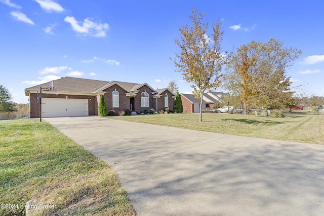 ranch-style home with a garage and a front lawn