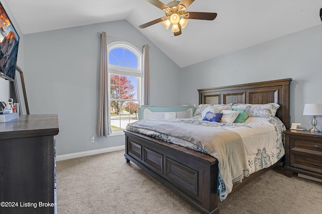 bedroom with light carpet, lofted ceiling, and ceiling fan