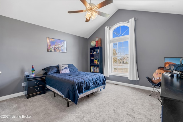 bedroom featuring vaulted ceiling, carpet floors, and ceiling fan