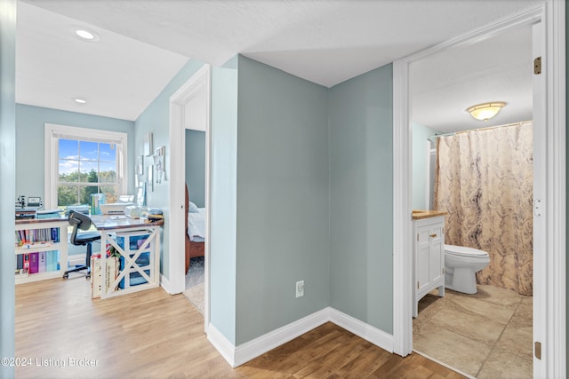 hallway featuring light wood-type flooring