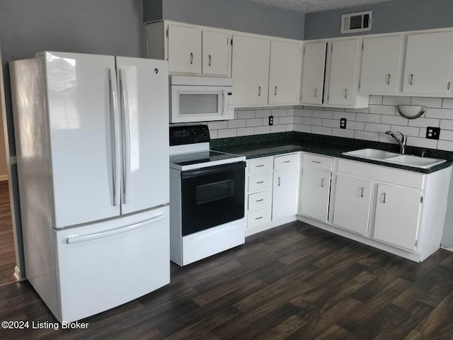 kitchen featuring white appliances, dark hardwood / wood-style flooring, sink, and white cabinets