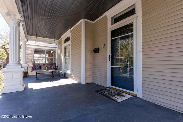 doorway to property with a porch