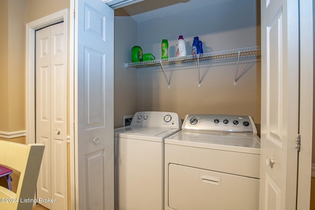 washroom featuring washer and dryer