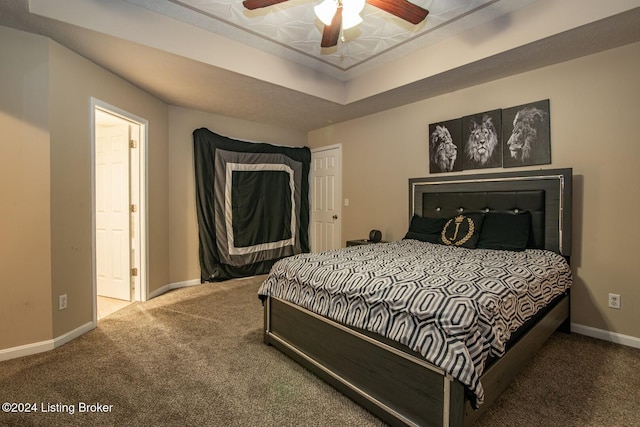 bedroom with ceiling fan and carpet floors