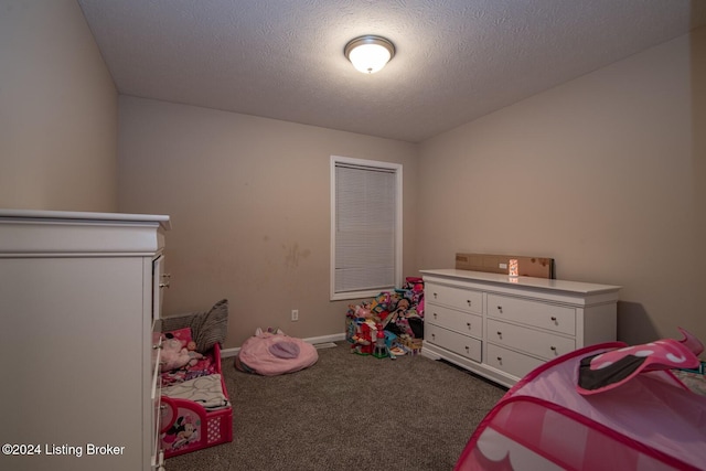 bedroom with carpet flooring and a textured ceiling