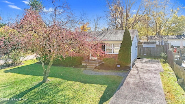 view of front of home with a front lawn