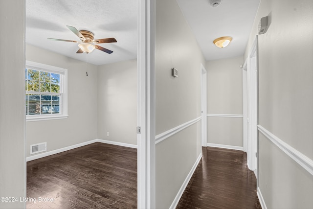 hall with dark hardwood / wood-style flooring