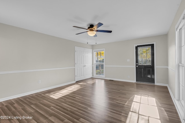 empty room featuring dark hardwood / wood-style floors and ceiling fan