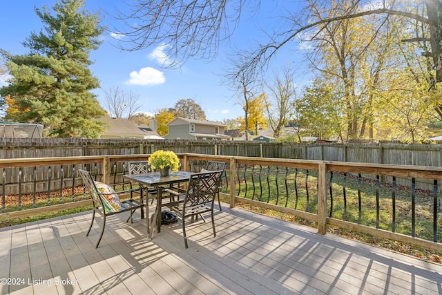 wooden deck with a yard