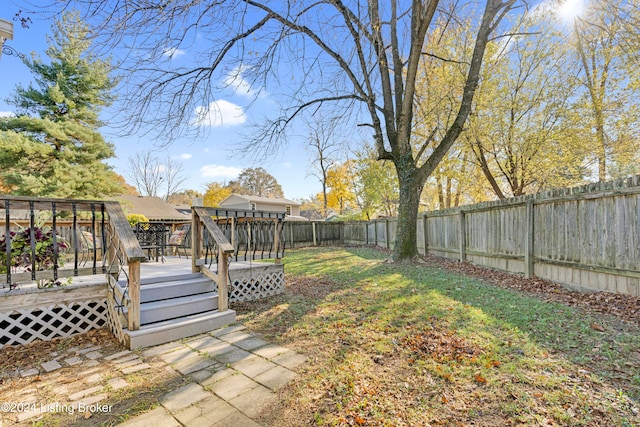 view of yard featuring a wooden deck