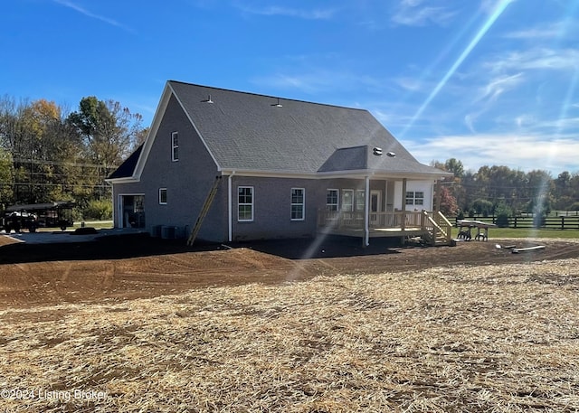 rear view of house with cooling unit