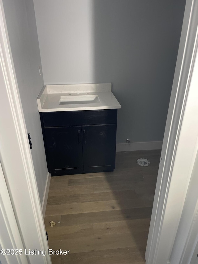 bathroom featuring vanity and hardwood / wood-style floors