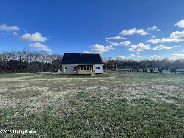 view of yard with a rural view