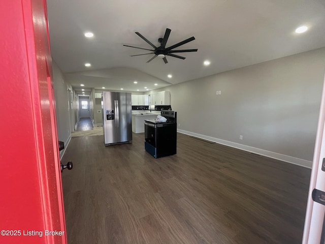 kitchen featuring dark wood-style flooring, recessed lighting, white cabinets, a kitchen island, and stainless steel fridge with ice dispenser