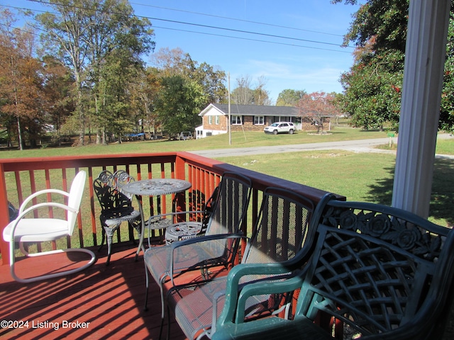 wooden deck with a yard