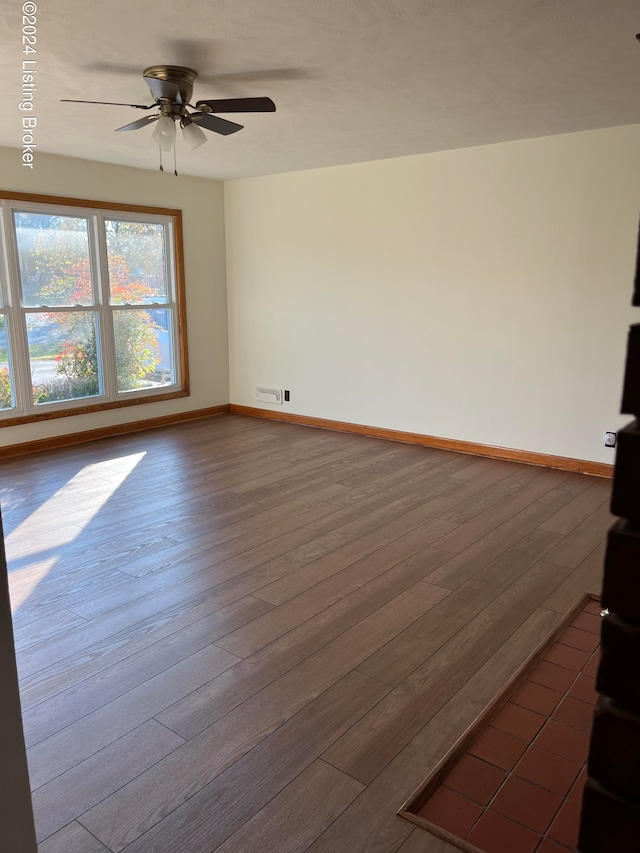 interior space with ceiling fan