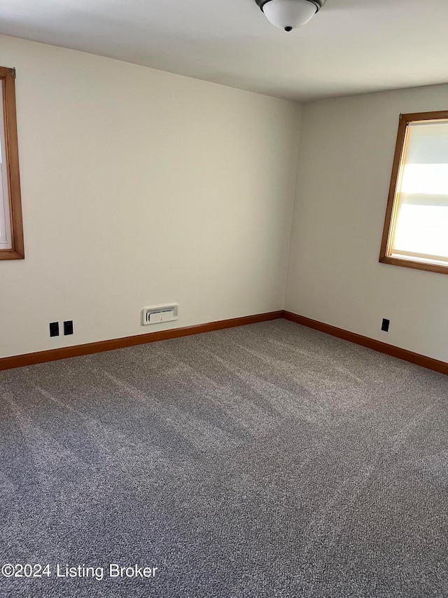 unfurnished room with carpet floors