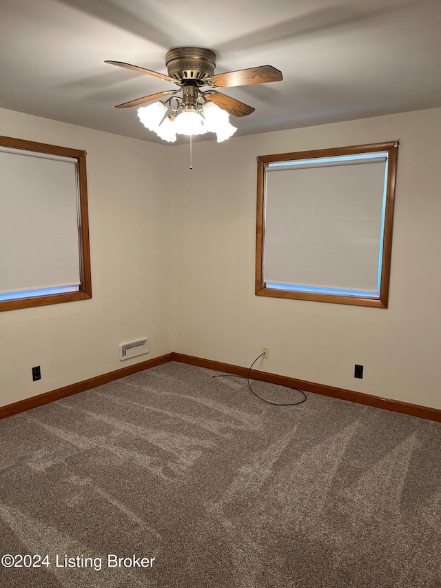 carpeted empty room with ceiling fan