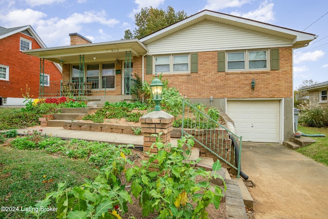 view of front of home featuring covered porch and a garage