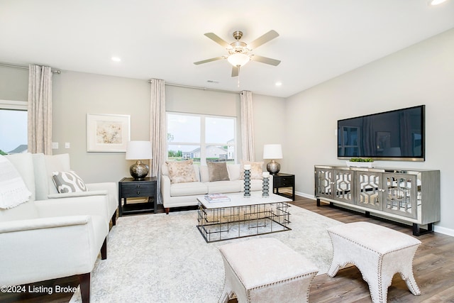 living room with hardwood / wood-style flooring and ceiling fan