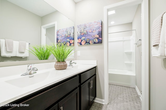 bathroom featuring shower / bathing tub combination and vanity