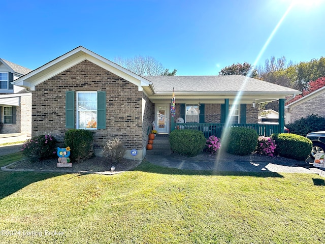 ranch-style house with a front yard and a porch