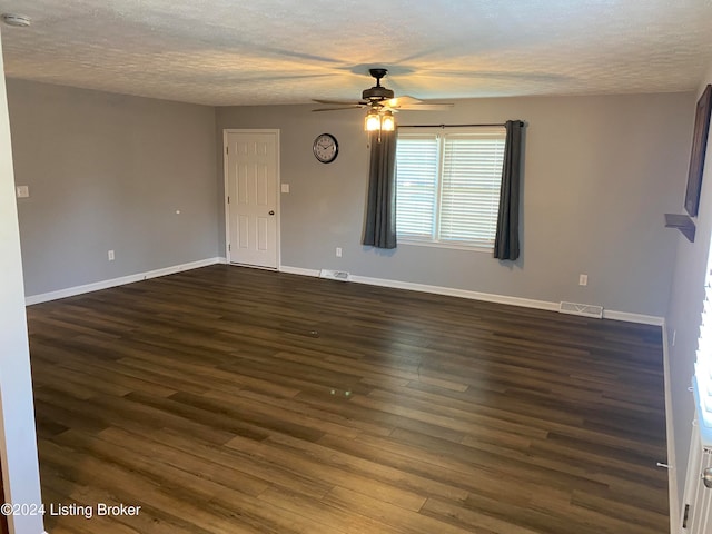 unfurnished room featuring dark hardwood / wood-style floors, a textured ceiling, and ceiling fan