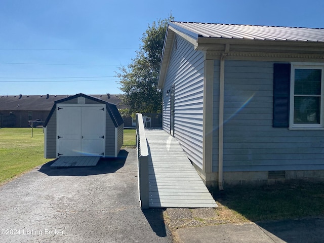 view of property exterior featuring a shed and a yard