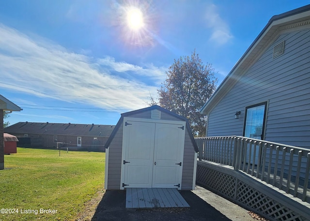 view of outbuilding featuring a yard