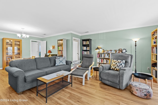 living room featuring crown molding, light hardwood / wood-style floors, and a notable chandelier