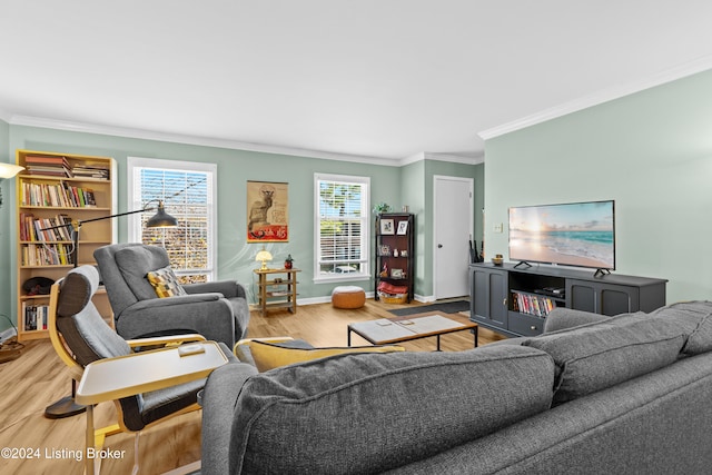 living room featuring crown molding and hardwood / wood-style flooring