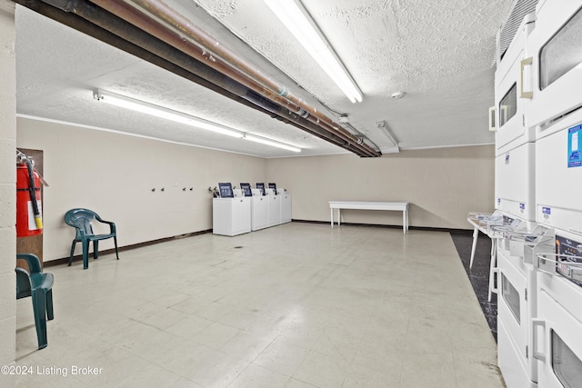 garage with stacked washer and dryer