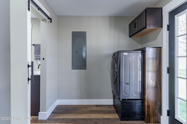 216 Millerstown St, Clarkson, KY 42726 - washroom featuring a barn door, electric panel, dark wood-style flooring, baseboards, and cabinet space