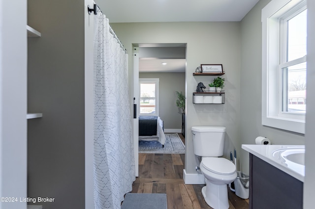 216 Millerstown St, Clarkson, KY 42726 - bathroom featuring toilet, vanity, wood finished floors, baseboards, and curtained shower
