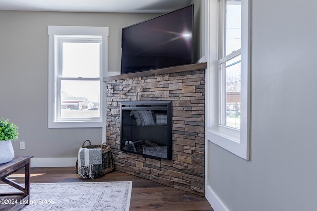 216 Millerstown St, Clarkson, KY 42726 - living room with baseboards, a stone fireplace, and wood finished floors