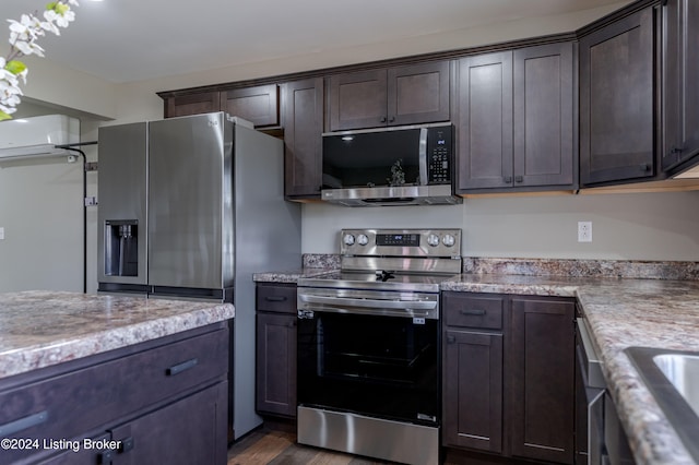 216 Millerstown St, Clarkson, KY 42726 - kitchen with stainless steel appliances, dark brown cabinets, and a wall unit AC