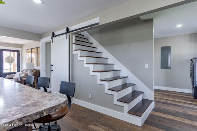 216 Millerstown St, Clarkson, KY 42726 - office featuring electric panel, recessed lighting, a barn door, baseboards, and dark wood-style floors
