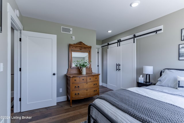 216 Millerstown St, Clarkson, KY 42726 - bedroom with a barn door, dark wood-style floors, recessed lighting, and baseboards