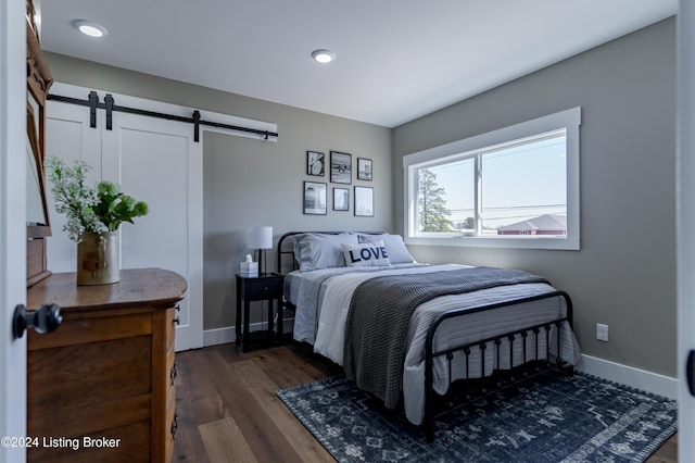 216 Millerstown St, Clarkson, KY 42726 - bedroom with a barn door, dark wood-style floors, baseboards, and recessed lighting