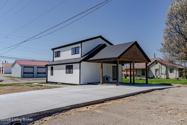 216 Millerstown St, Clarkson, KY 42726 - modern inspired farmhouse with metal roof, driveway, and an outdoor structure