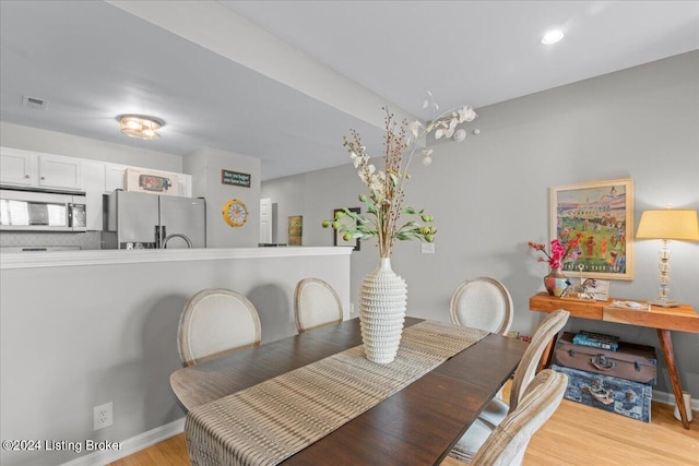 dining area with light wood-type flooring