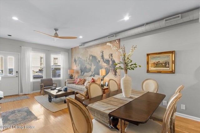 dining room with ceiling fan, a healthy amount of sunlight, and light hardwood / wood-style flooring