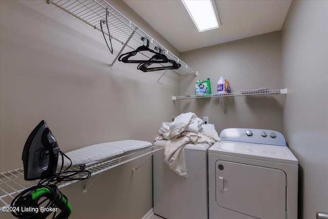 washroom featuring washer and clothes dryer