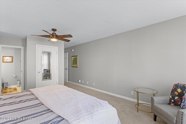 carpeted bedroom featuring ensuite bathroom and ceiling fan