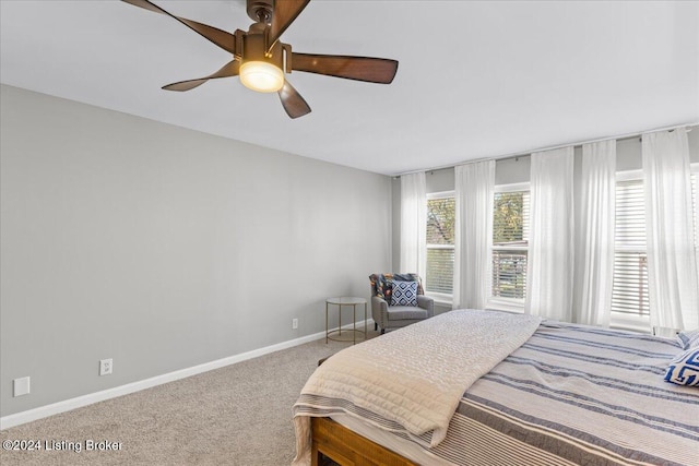 bedroom with ceiling fan and carpet floors