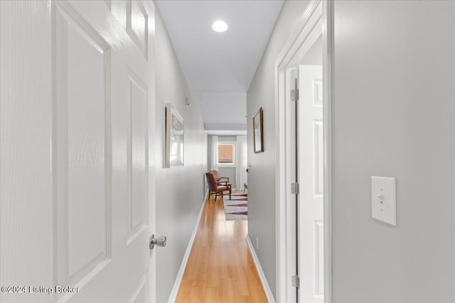 corridor featuring light hardwood / wood-style floors