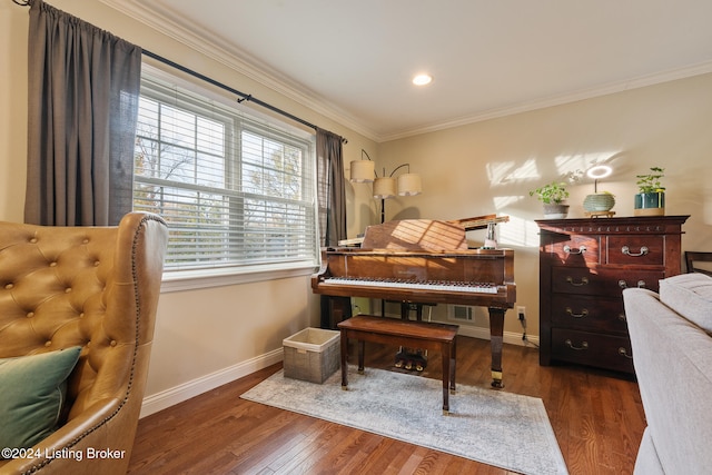 sitting room featuring dark wood-type flooring and ornamental molding