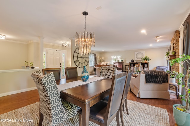 dining room featuring ornamental molding and hardwood / wood-style floors