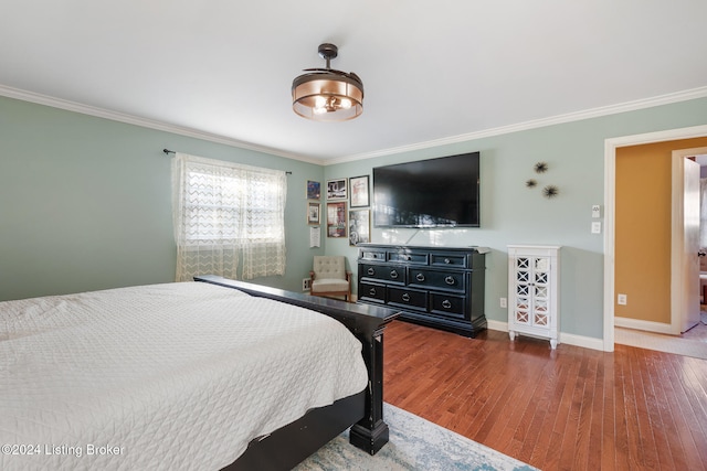 bedroom featuring ornamental molding and dark wood-type flooring